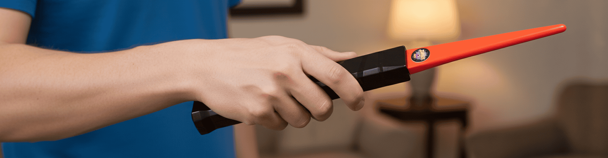 A person's arm holding a Zapper from ZappedYou.Com